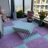 Soft plush interlocking floor tiles in pink and blue squares with stuffed animals on a window sill