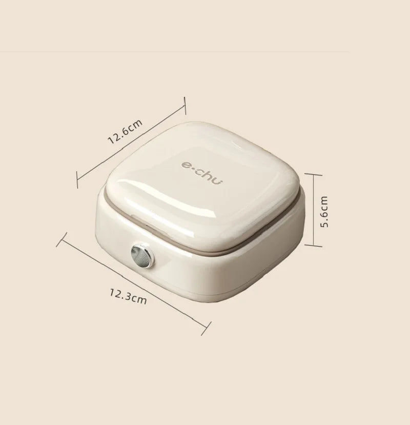 A white compact magnetic sewing kit with a lid, shown from above.