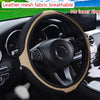 Leather mesh fabric breathable steering wheel cover with diamond accents installed in a car interior.