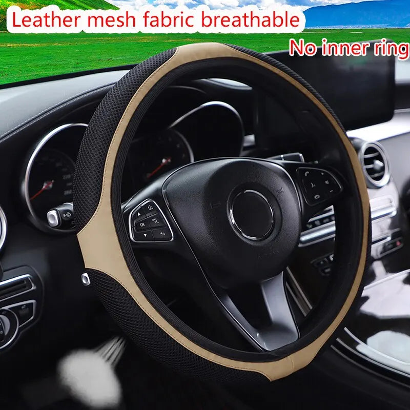 Leather mesh fabric breathable steering wheel cover with diamond accents installed in a car interior.