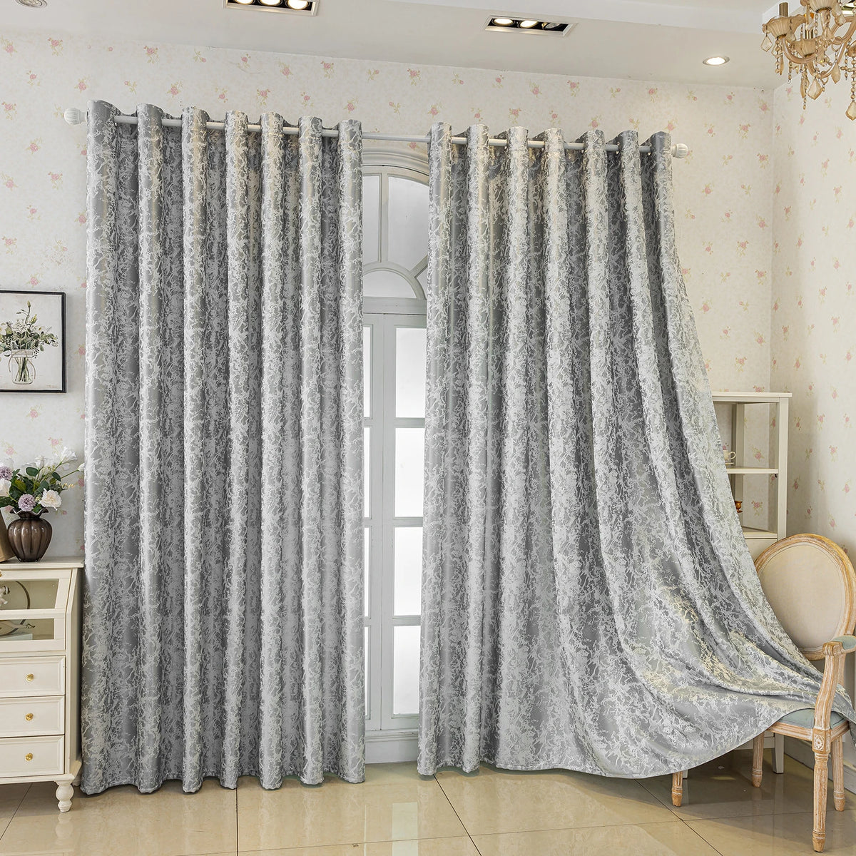 Gray tree bark jacquard blackout curtain panels hanging in a bright room.
