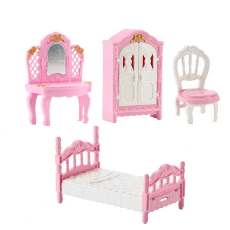 Pink miniature dollhouse furniture set including a vanity, cabinet, and bed for a bedroom