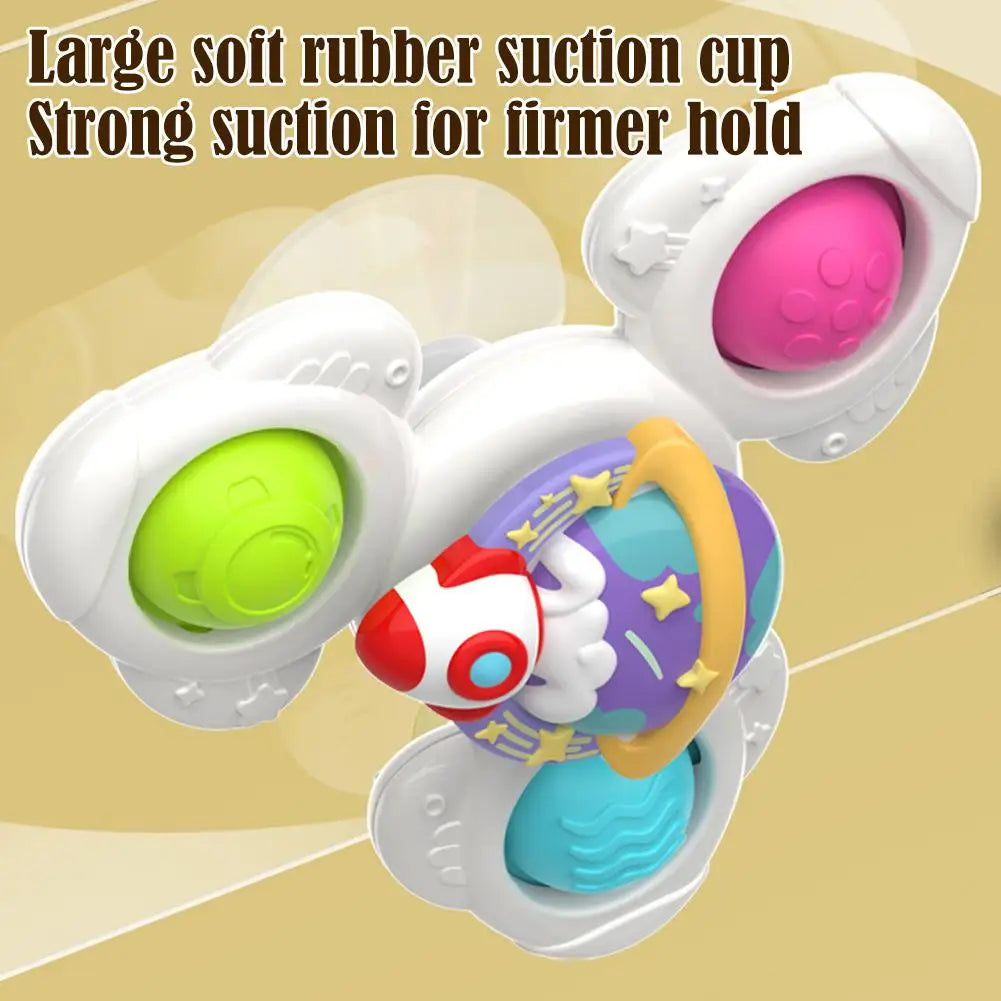 White suction cup toys with colorful spinner beads and a soft rubber grip for baby sensory play