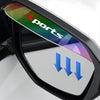 A close-up of a flexible sports rain guard for a car side mirror, featuring a multicolored design and blue arrows.
