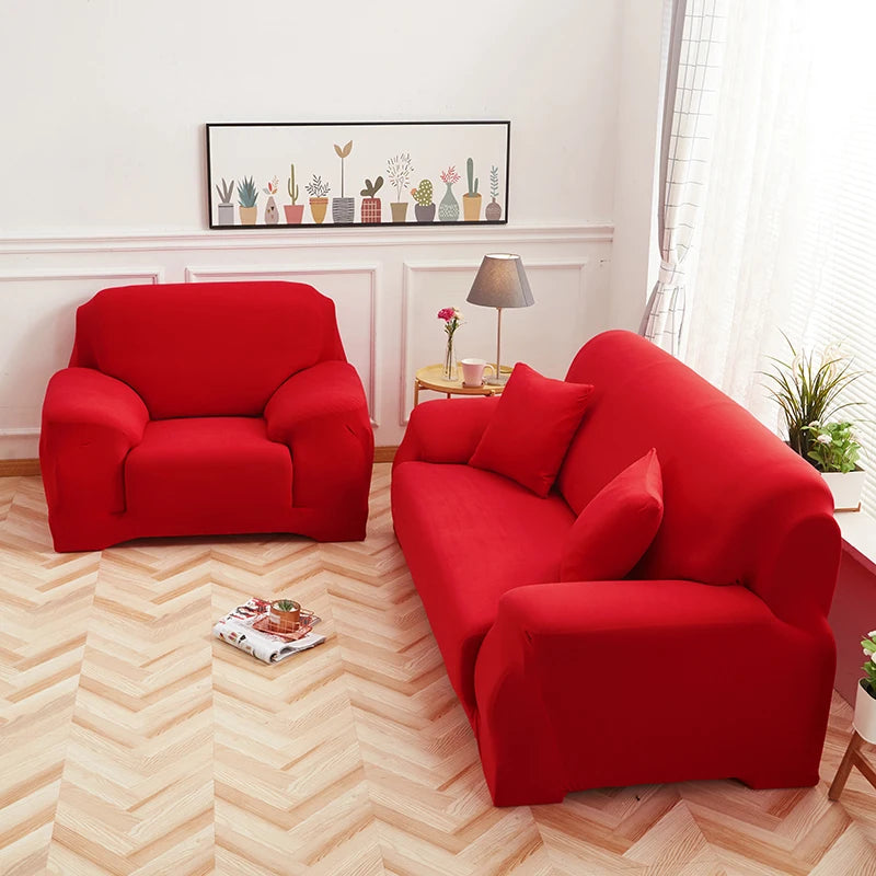 A vibrant red silky soft stretchable sofa cover displayed in a living room setting.