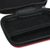 Black portable electronics organizer pouch with a mesh interior and red trim.