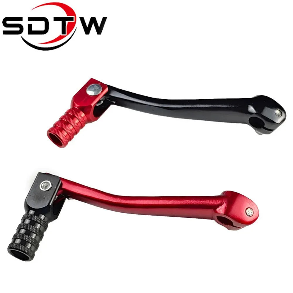 A close-up view of a red CNC aluminum folding gear shift lever for motorcycles and dirt bikes.