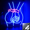 Pink neon silhouette wall sign depicting a heart shape with hands, illuminated against a dark blue background.