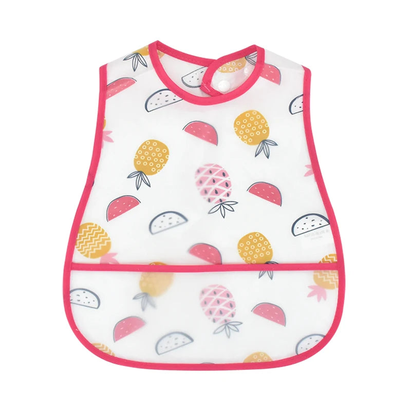 White baby feeding bib with pink trim featuring fruit designs and a catch pocket