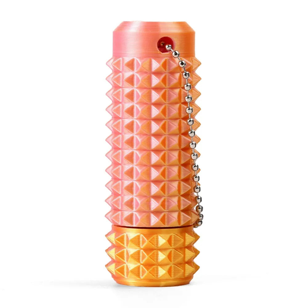 A pink spiky sensory fidget roller with a gold accent, shown vertically.