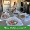 A clear mesh food cover is shown on a table, used to protect food during outdoor dining.