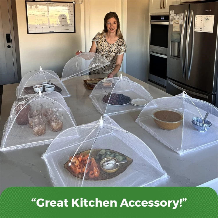 A clear mesh food cover is shown on a table, used to protect food during outdoor dining.