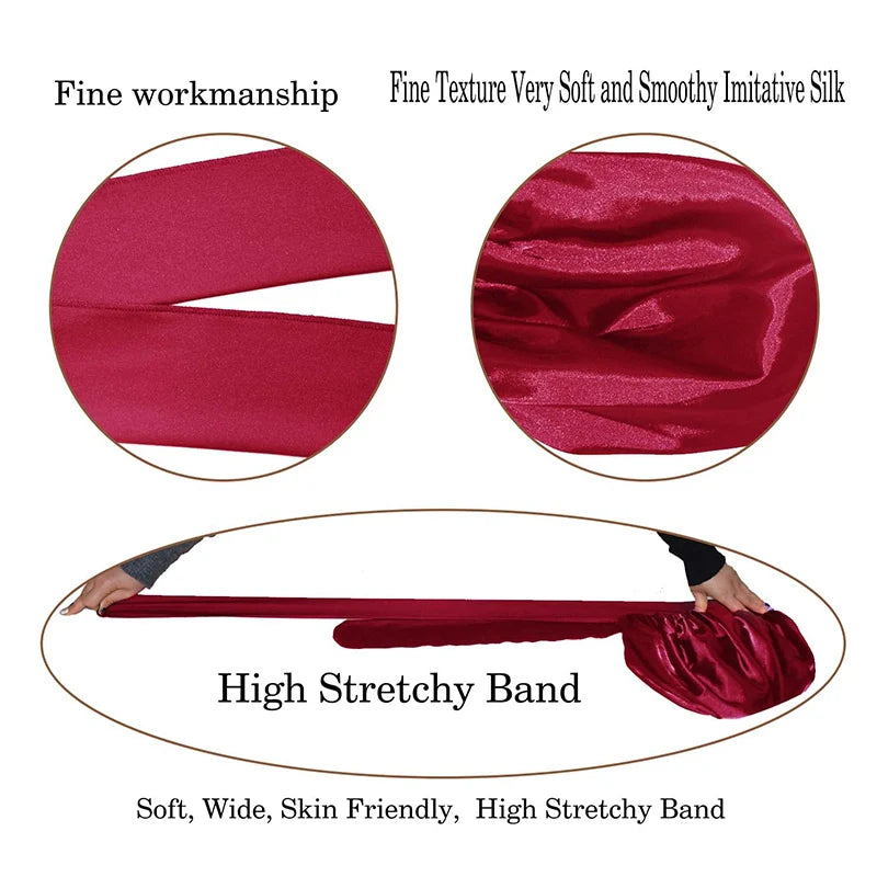 A deep magenta silky satin sleep cap with a high stretchy band shown in detail.