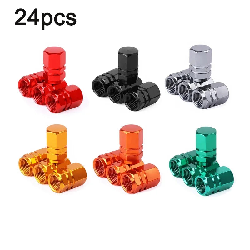 A set of four aluminum alloy wheel tire valve caps in various colors including red, black, silver, and green.