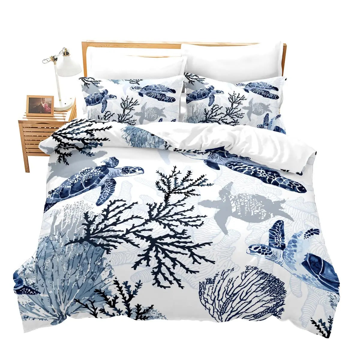 A set of sea turtle patterned duvet covers and pillowcases with a white background.