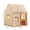 A beige princess castle play tent with a checkered roof and a window showing a stuffed animal inside.