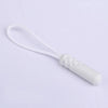 A white replacement zipper pull with a nylon cord attached.