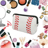 A white cosmetic bag with red embroidery, surrounded by various makeup products and tools.