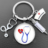 Silver nurse keychain featuring a heart and stethoscope design with a medical cross emblem.
