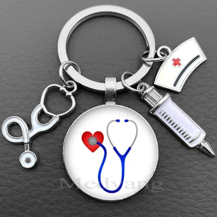 Silver nurse keychain featuring a heart and stethoscope design with a medical cross emblem.