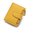 A yellow genuine leather RFID blocking bifold wallet shown in a diagonal angle.