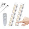 A rechargeable LED under-cabinet light bar with a remote control and touch sensor is shown next to its charging cable.