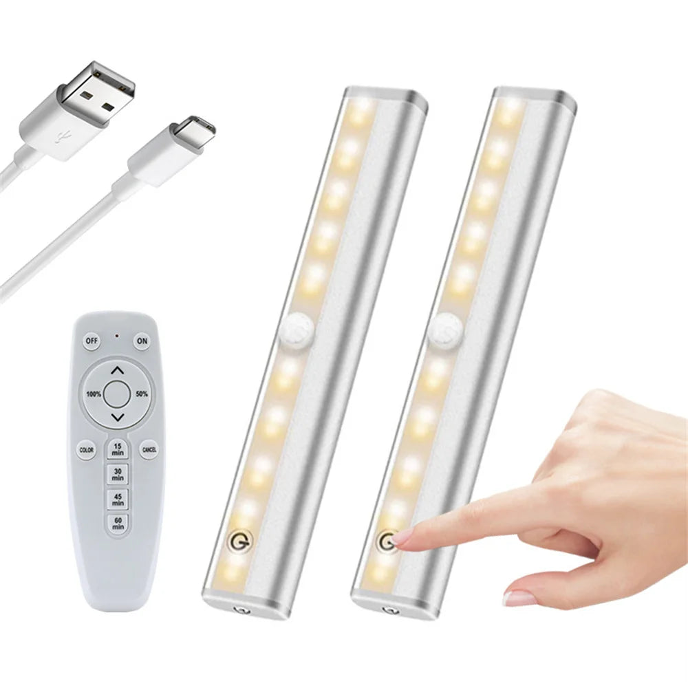 A rechargeable LED under-cabinet light bar with a remote control and touch sensor is shown next to its charging cable.