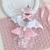 A pink and white decorative utility cutter featuring a cat paw design with a replaceable blade and pink ribbon accents.