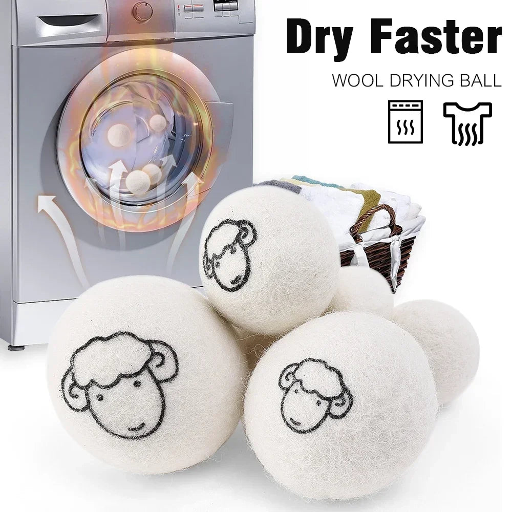 A set of six white wool drying balls next to a laundry machine, demonstrating a faster drying method.