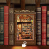 A collection of old-looking books and a miniature wooden book house shelf insert displayed on a wooden surface.
