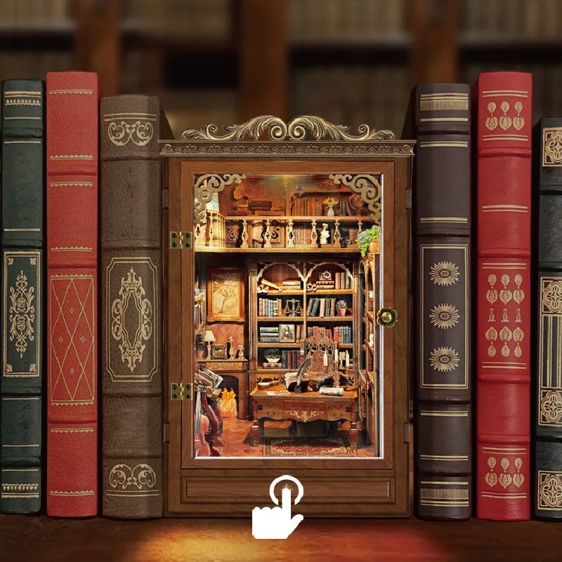 A collection of old-looking books and a miniature wooden book house shelf insert displayed on a wooden surface.