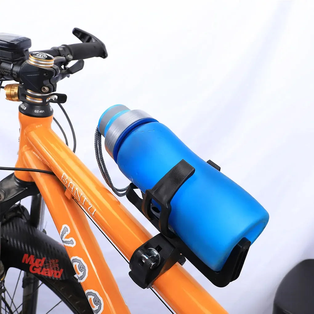 An orange bicycle features a blue water bottle cage mounted on the frame.