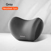 Gray memory foam car headrest and lumbar support pillow shown on a white surface.