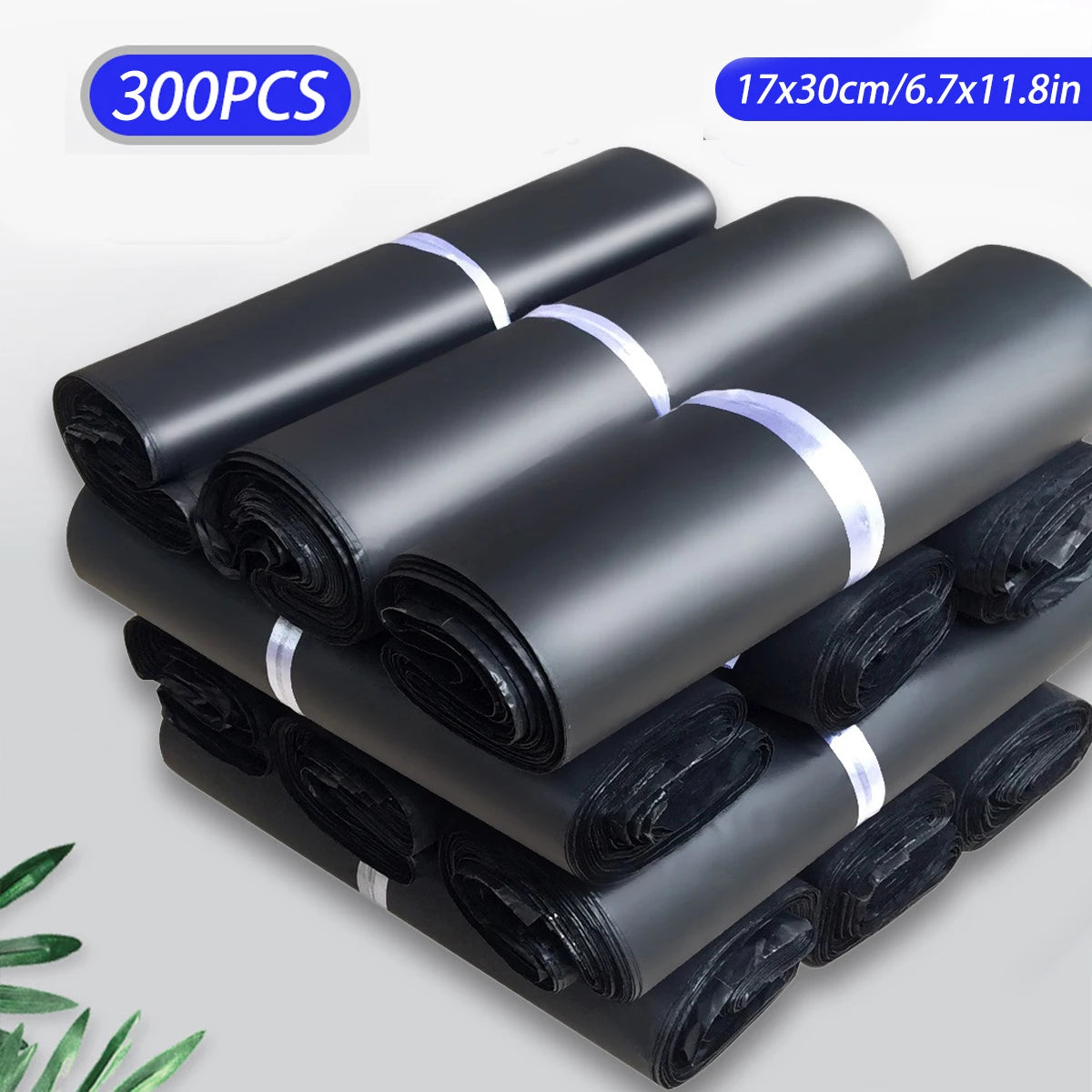 A stack of black self-seal poly mailer bags for shipping, packaged in rolls.