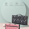 A black patterned foldable waterproof baby changing pad is shown next to a pink floral patterned version.