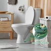 A white ceramic toilet with a green frog bolt cover mounted on the wall next to wooden shelving.