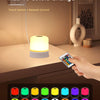 A hand is operating a touch switch and remote control to change the color of an RGB night light.