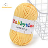 A ball of yellow soft T-shirt yarn for crochet and knitting is shown next to a wire basket.