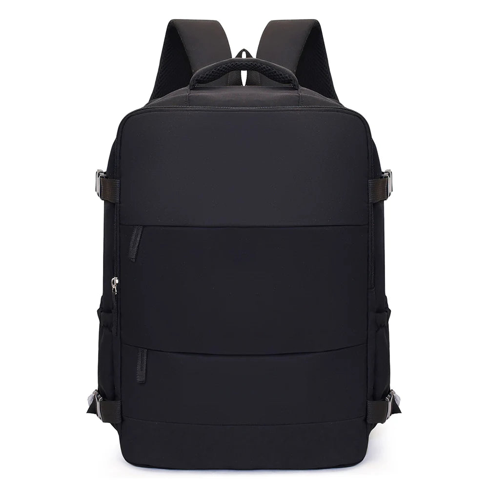 A black compact cabin travel backpack with padded straps and external pockets.