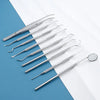 A set of premium stainless steel dental care tools for oral hygiene laid out on a blue and white surface.