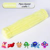 A bundle of light yellow chenille pipe cleaners with various animal shapes.