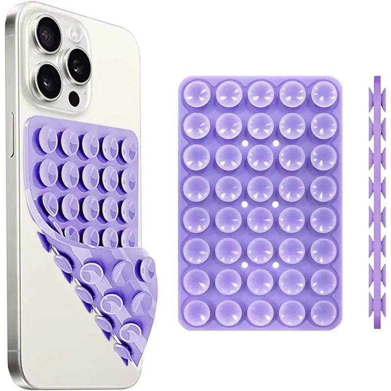 A white smartphone case and a purple suction cup phone mount with multiple silicone cups for hands-free use.