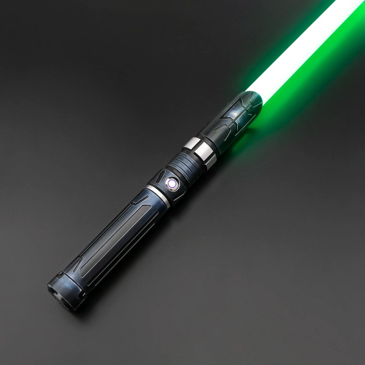 A close-up of a Neo Pixel lightsaber with a glowing green blade, shown diagonally against a dark background.