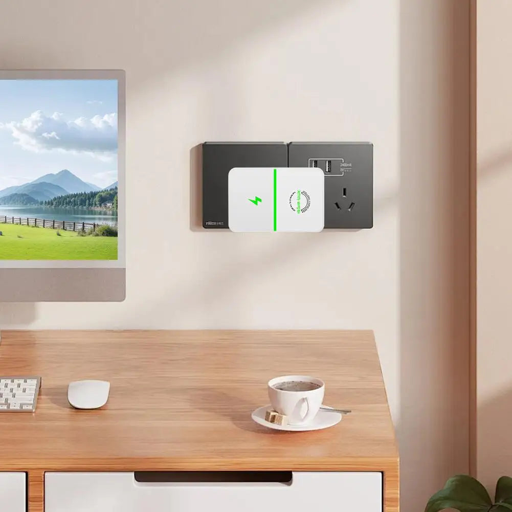 A white voltage stabilizer and energy saver plug unit mounted on a wall above a wooden table.