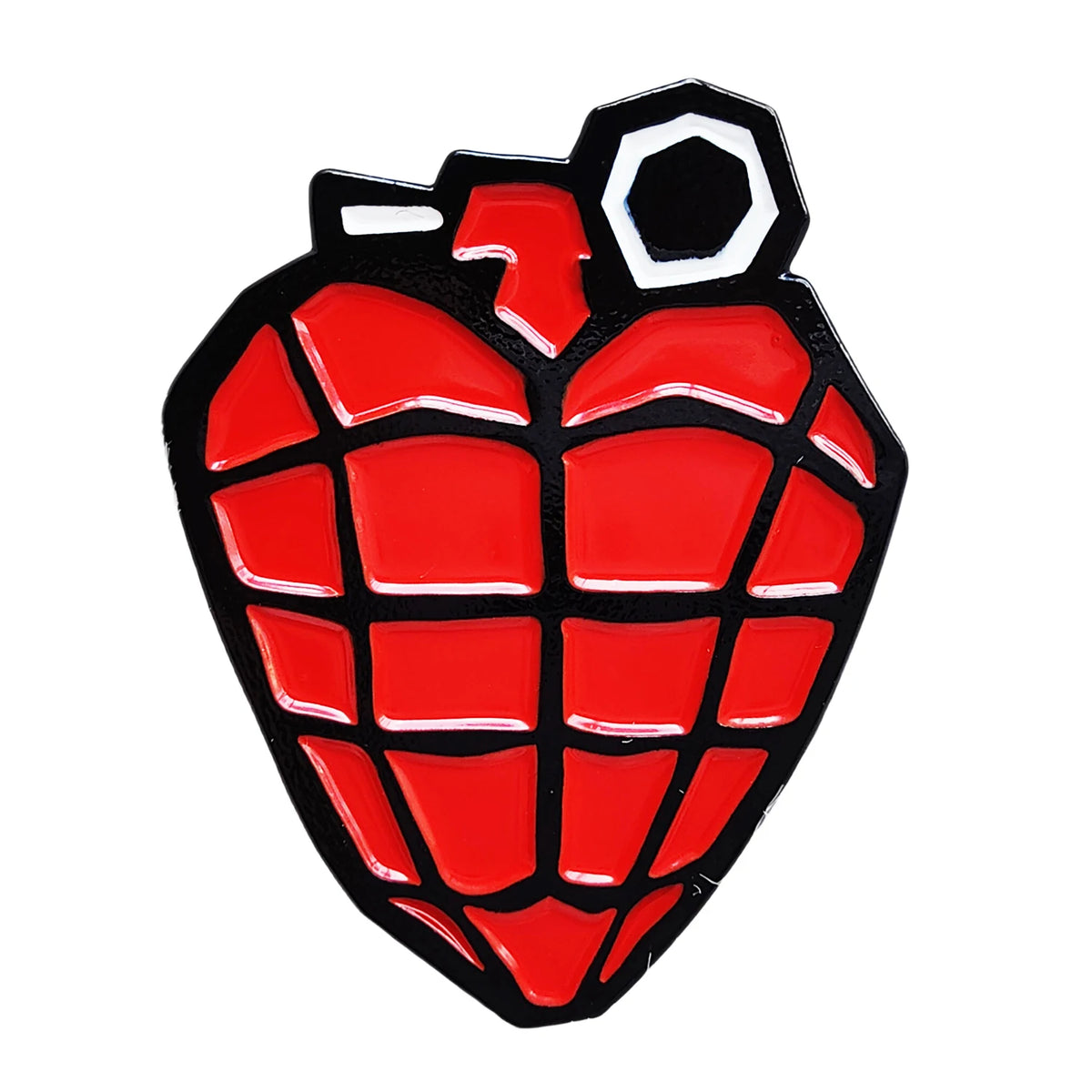 A red pineapple shaped pin featuring a black and white design.