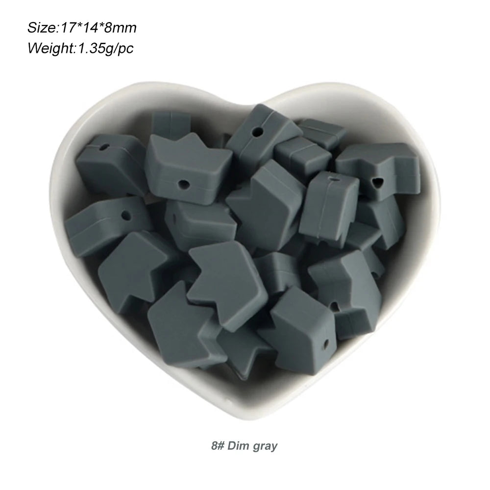 A pile of 8 silicone dim gray crown star heart beads for DIY jewelry making