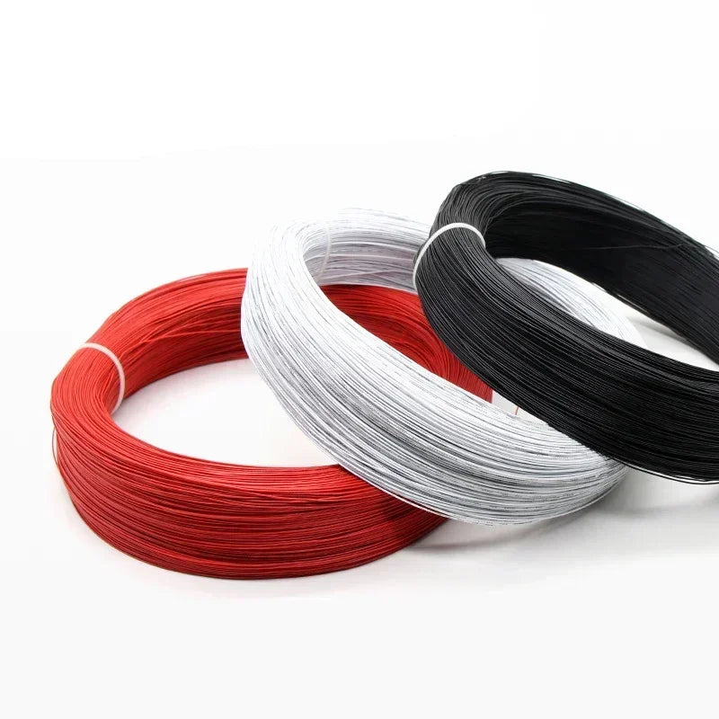 Three spools of tinned copper hook-up wire in red, silver, and black PVC insulation.