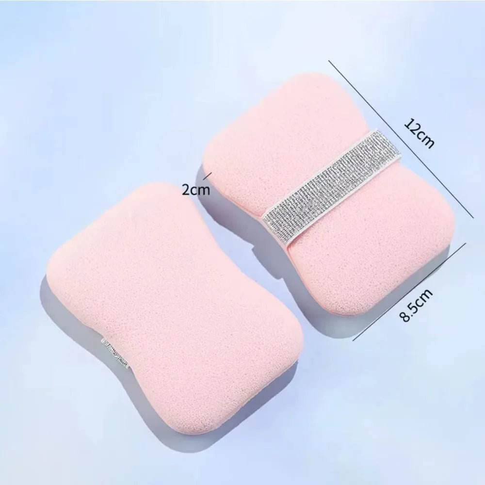 A pink foaming soap saver bag with a mesh exfoliating strip shown from above and side view.