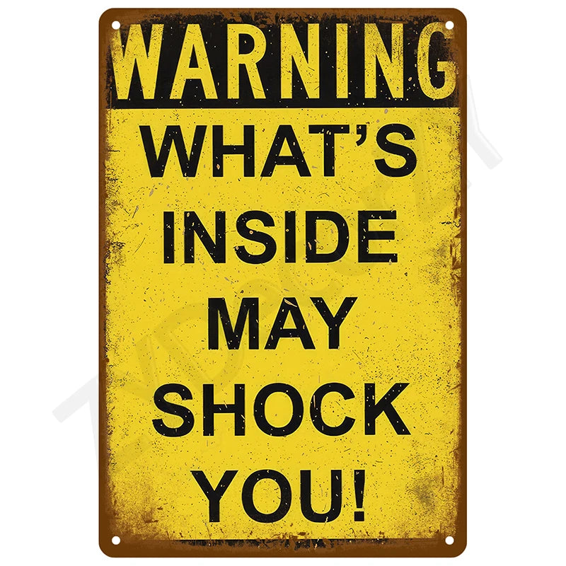 A vintage yellow metal tin sign with black text warning that what's inside may shock you.