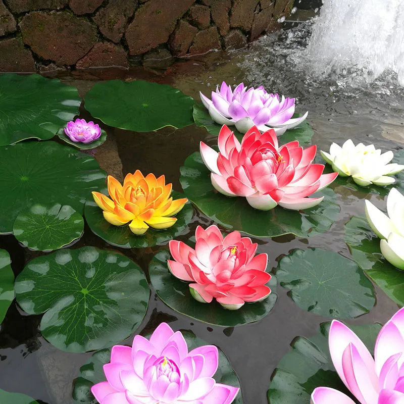 Pink and yellow lotus flowers floating on water in a pond or garden setting